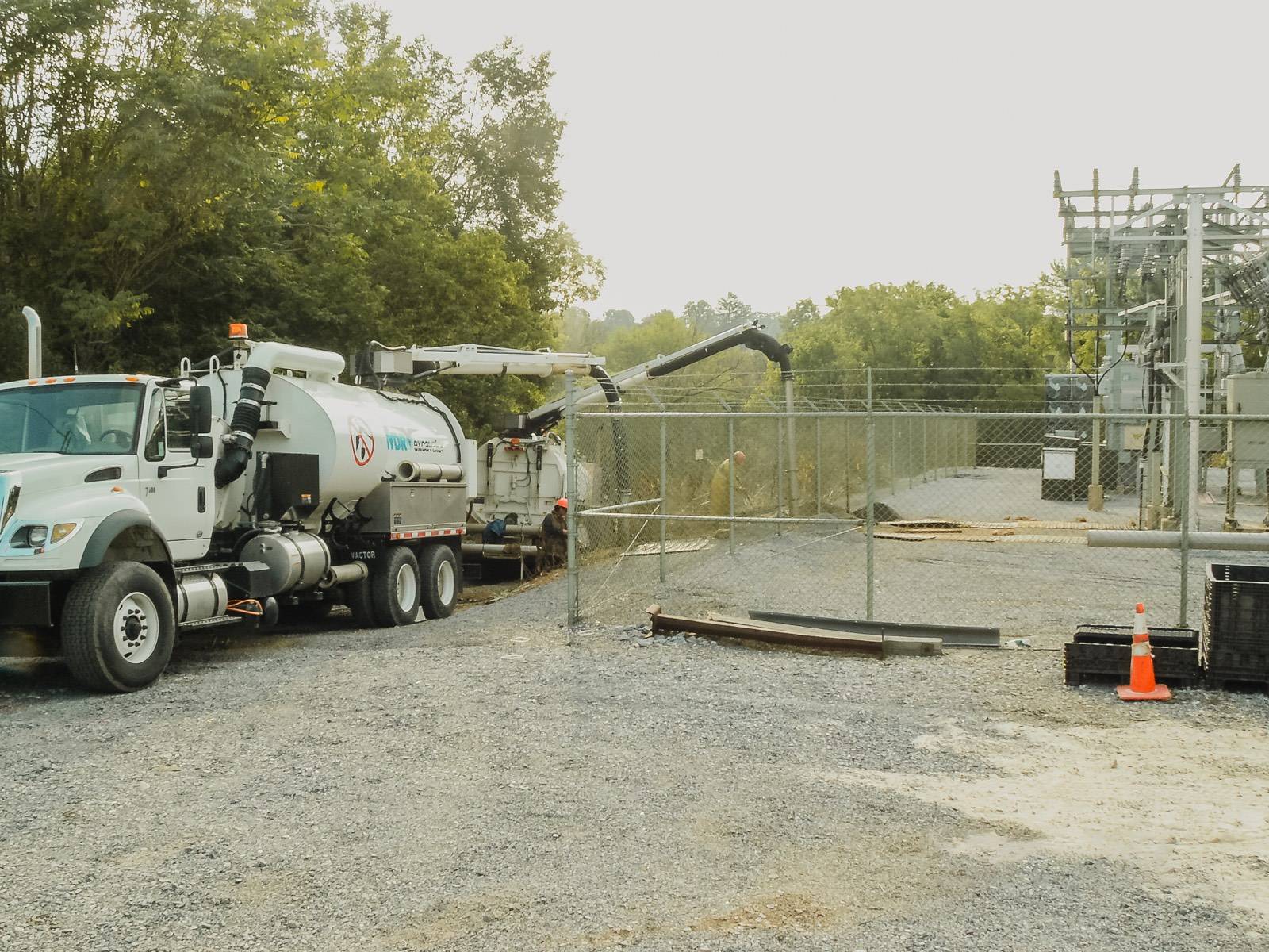 E&H hydro-vac truck working at a substation fence line