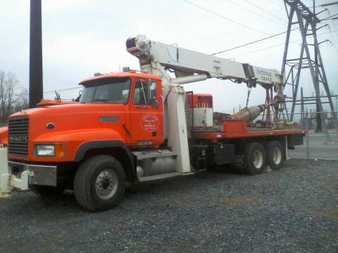 E&H crane truck staged at a transmission structure