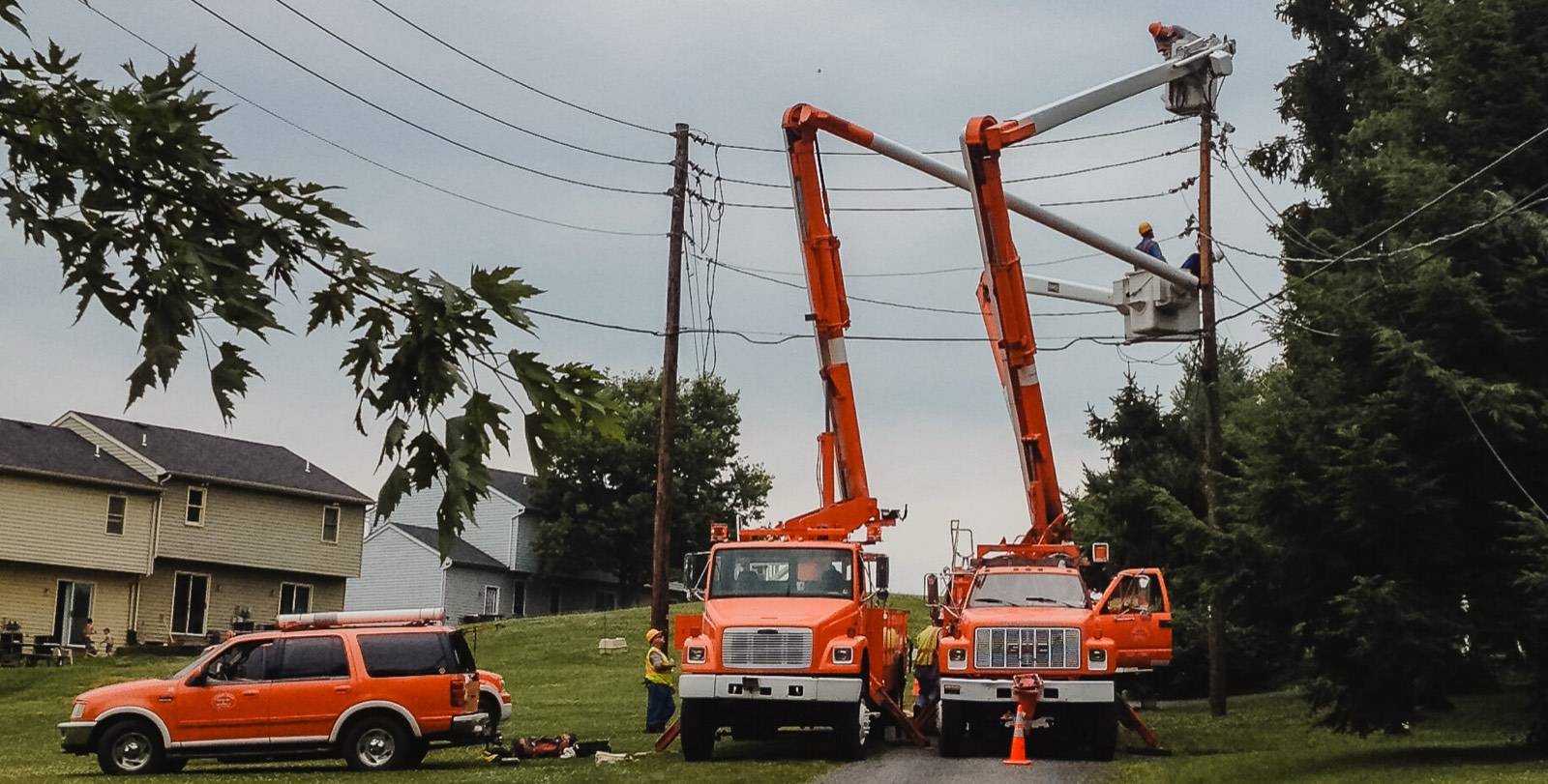 Crews and trucks staged on a residential line