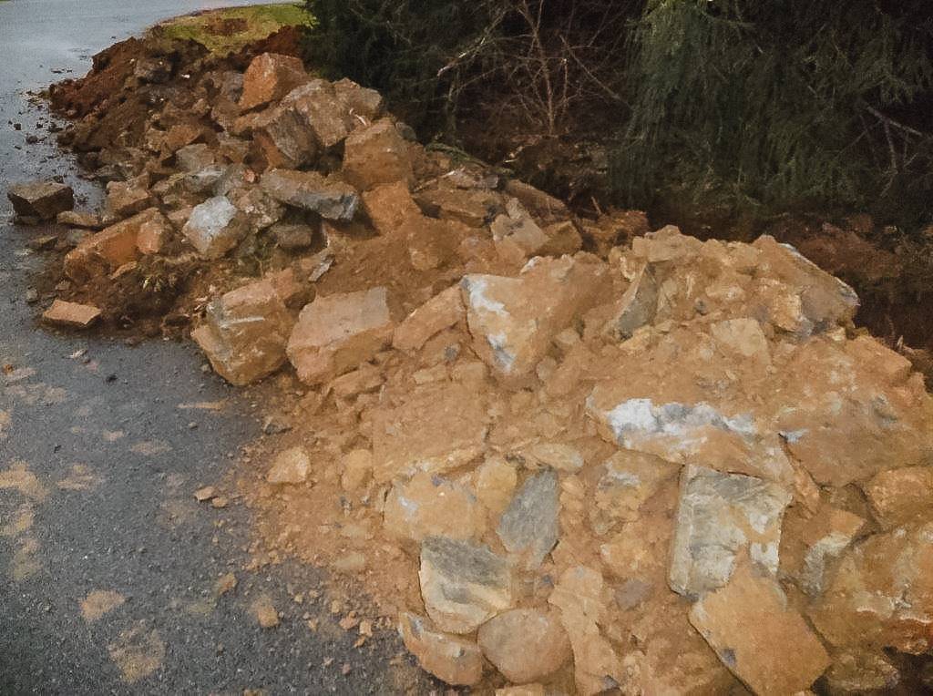 Rock spoil piled at the edge of the site
